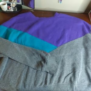 A gray, blue, and purple sweatshirt